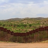Border Fence Separating the US from Mexico Near Nogales, Arizona. Image copyright: Linda Johnsonbaugh